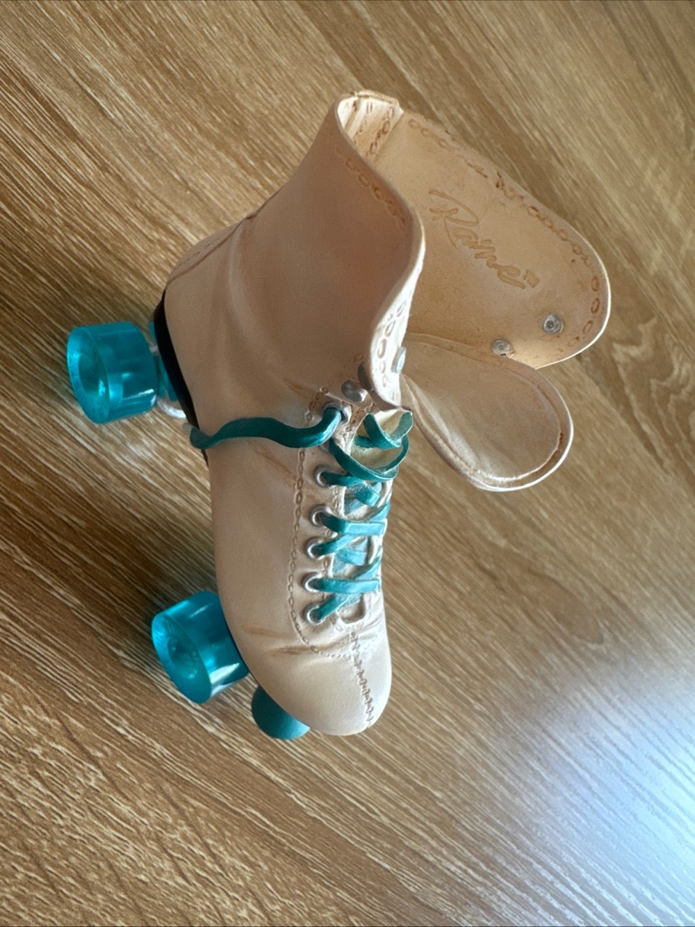 Classic Cream Roller Skates with Teal Accents
